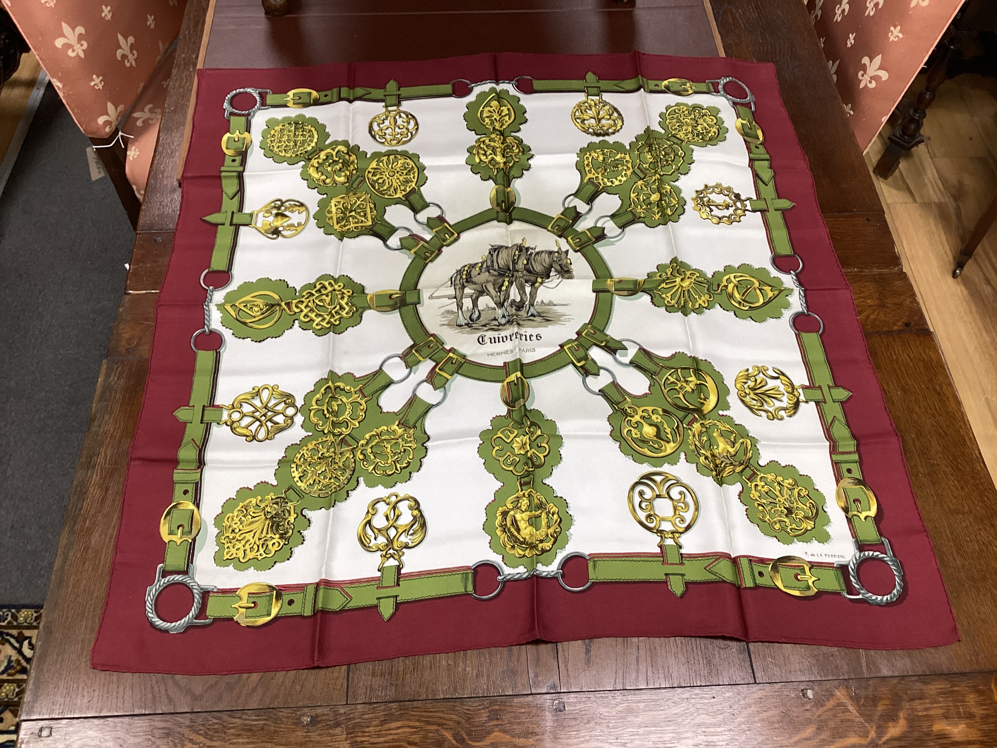 Four vintage Hermes silk scarves including two retailed by Harrods comprising Cuivreries, Roues de Canon, Napoleon and Puzzle